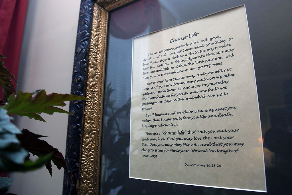 A verse is framed in the common area
